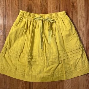 Anthropologie women’s knee length skirt in yellow size S